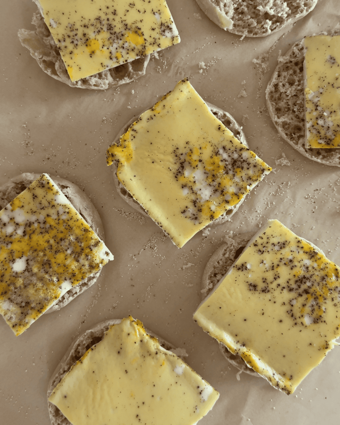 Sheet pan egg squares on Thomas' Light English muffins for make ahead breakfast sandwiches